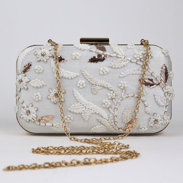 white embroidered clutch bag