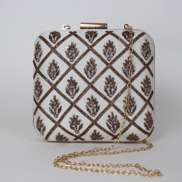white and gold embroidered clutch